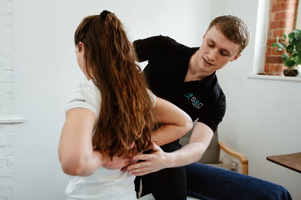 chartered physiotherapist Charlie treating patient at S&C Therapy Norwich clinic